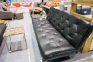 Abstract blur sofa in furniture showroom store interior with bokeh light background for montage product display photo