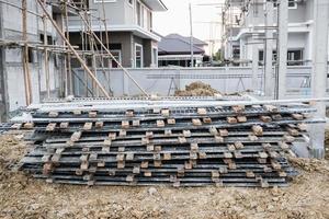 installation of cement formwork frames to new house construction at building site, real estate development photo