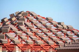 Roof house construction with lots of tile prepare to Install photo