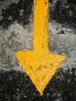 traffic direction arrow on the road photo