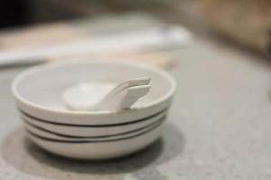 Japanese restaurant table with empty dish photo