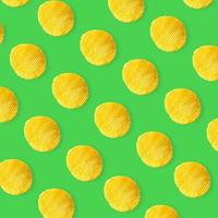 Potato chips pattern on pastel green background top view flat lay photo