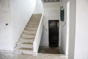 New house construction with concrete staircase at building site photo