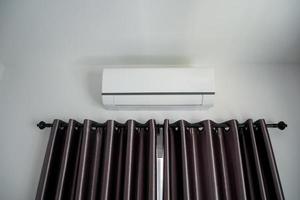 Air conditioner on wall in modern house room photo