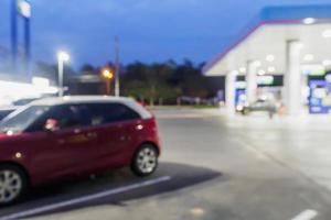 Blur Gas station at night time for background photo