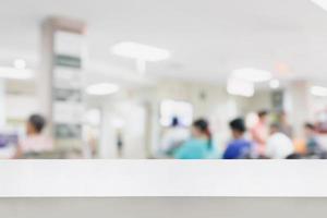 Empty white desk with blur hospital background photo