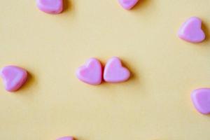 Valentines day background with heart shape candy photo