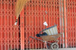 Old Wheelbarrow with old metal door photo