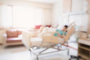 Abstract blur Patient on bed in Hospital Room interior for background photo