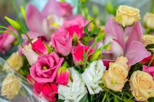 Bouquet with orchids and roses on a beautiful background photo