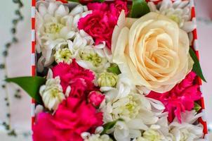 Beautiful bouquet of mixed flowers of chrysanthemums, cloves and roses photo