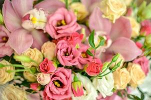 Bouquet with orchids and roses on a beautiful background closeup photo