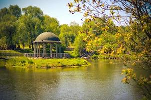 Gazebo or alcove on shore of lake in Feofaniya, Ukraine photo