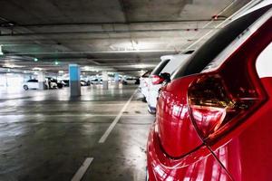 cars in parking garage interior photo