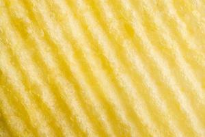 Potato chip texture background closeup photo