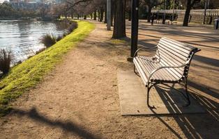 Empty chair in public park near Yarra river of Melbourne, Australia. photo