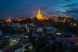 Night view of Shwedagon pagoda an iconic landmark of Yangon township of Myanmar. photo