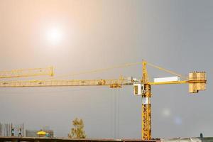 Construction tower crane at building site photo