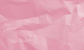 rose red colored crumpled paper texture background for design, decorative. photo