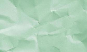 spring green colored crumpled paper texture background for design, decorative. photo