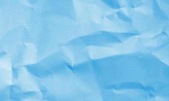 sky blue colored crumpled paper texture background for design, decorative. photo