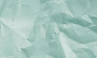 grass green colored crumpled paper texture background for design, decorative. photo