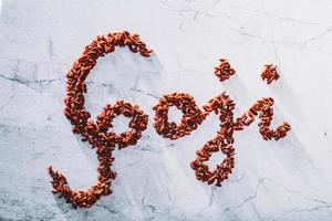 Goji word composed of little red goji berries. photo