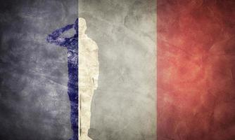 French grunge flag with soldier silhouette. photo