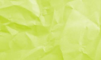 chartreuse colored crumpled paper texture background for design, decorative. photo