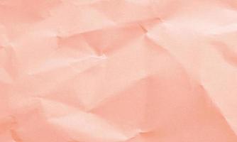 tropical pink colored crumpled paper texture background for design, decorative. photo