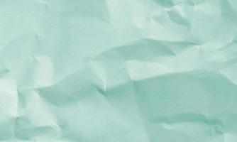 light green colored crumpled paper texture background for design, decorative. photo