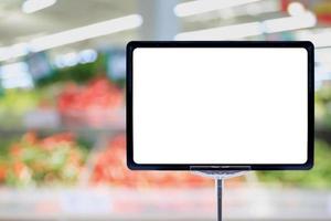 Blank price board sign display in Supermarket with fresh food abstract blurred background with bokeh light photo