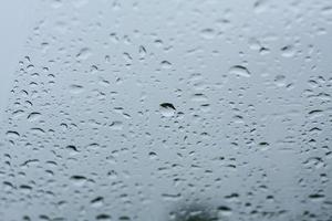 Natural water drops on glass photo