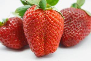 Red juicy wet strawberries closeup photo