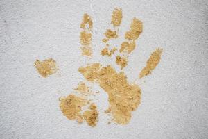 hand print on cement wall photo