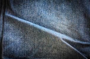 Texture of blue jeans background photo