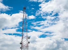 Telecommunication tower and satellite on blue sky photo
