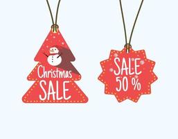 Vector red sale tag decorated with a red christmas tree and christmas sale letters adorned with a cute snowman hanging Vector illustration