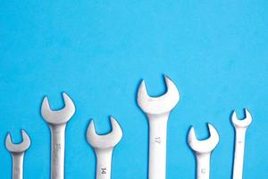 Set of wrenches on a blue background. photo