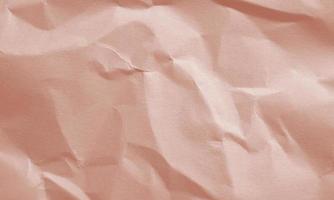 ruby red colored crumpled paper texture background for design, decorative. photo