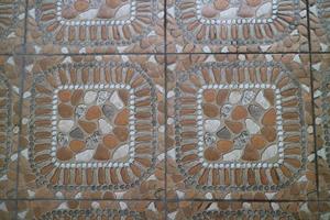 The texture of the orange embossed floor in front of the house photo