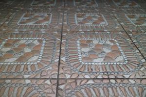 The texture of the orange embossed floor in front of the house photo
