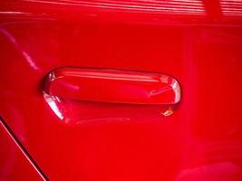 Red car door handle photo