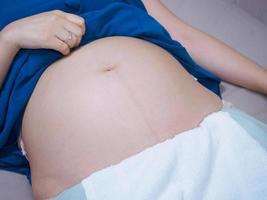 Pregnant woman on bed at hospital photo