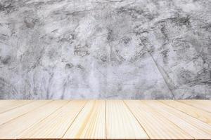 wood table top with cement wall background photo