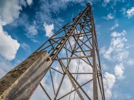 pile driver with clouds and blue sky photo