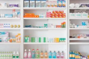 Pharmacy drugstore blur abstract backbround with medicine and healthcare product on shelves photo