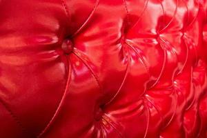 textura de sofá de cuero rojo de lujo foto