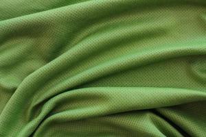 crumpled green fabric texture background photo