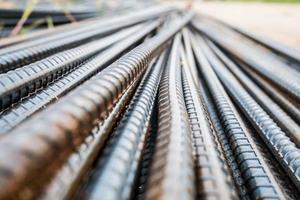 Deformed steel bars metal texture close up photo